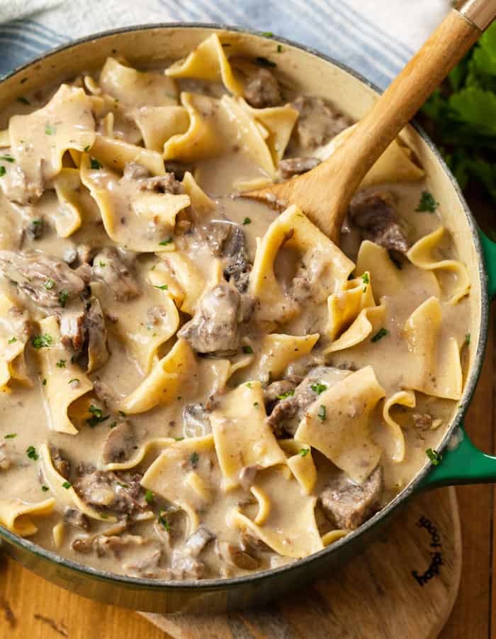 A dutch oven filled with hearty Beef Stroganoff made in the Slow Cooker.