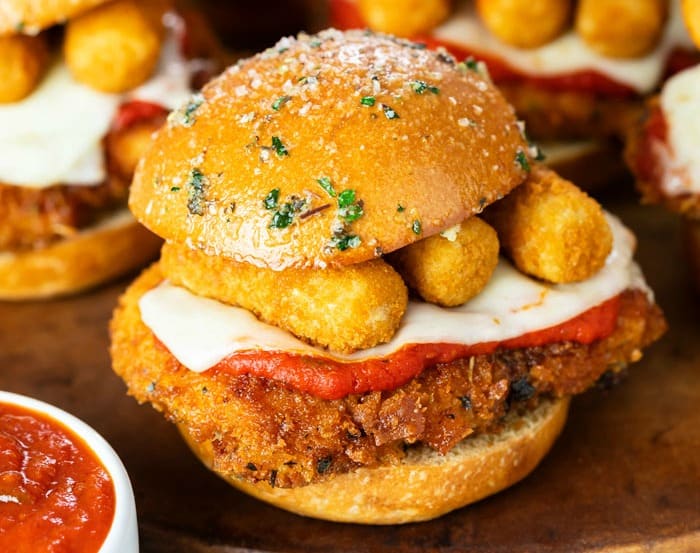 A chicken Parmesan slider topped with mozzarella sticks.