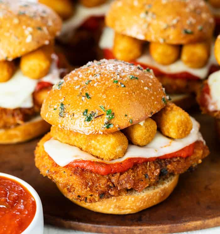 Chicken Parmesan Sliders topped with mozzarella sticks.