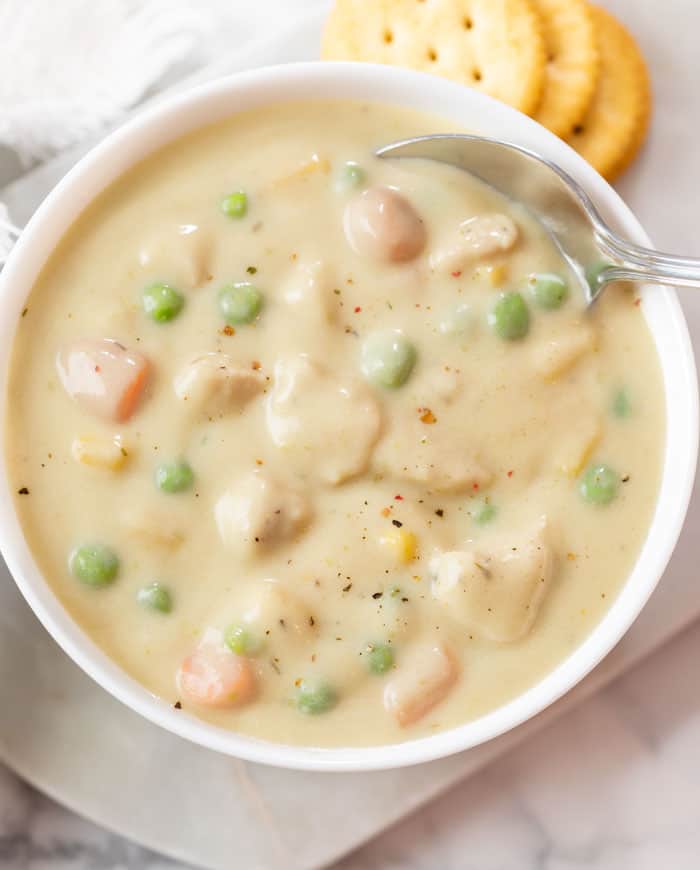 Overhead view of Chicken Pot Pie Soup in a white bowl.