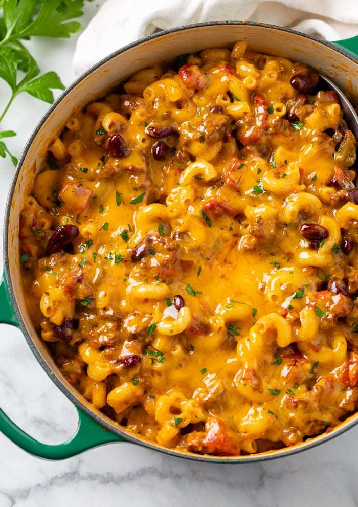 A Dutch oven filled with Cheesy Chili Mac.