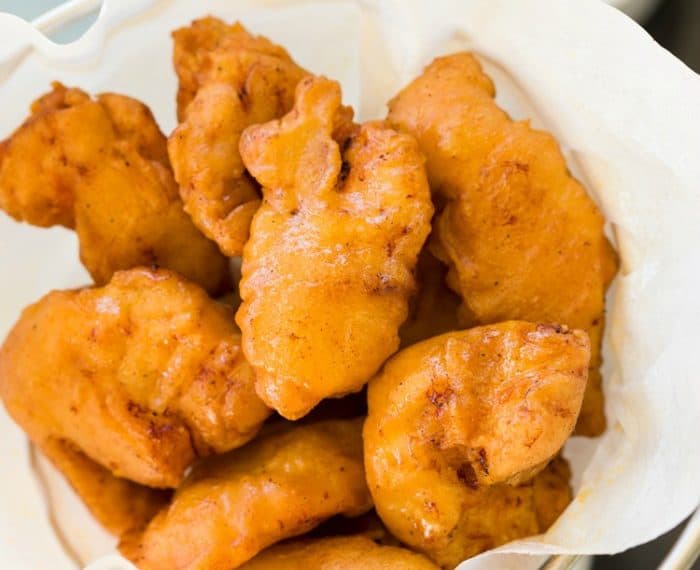 A pile of battered and fried Chinese chicken fingers.