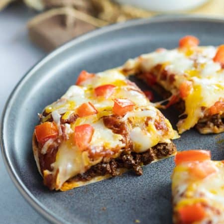 Taco Bell Mexican Pizza on a blue plate.