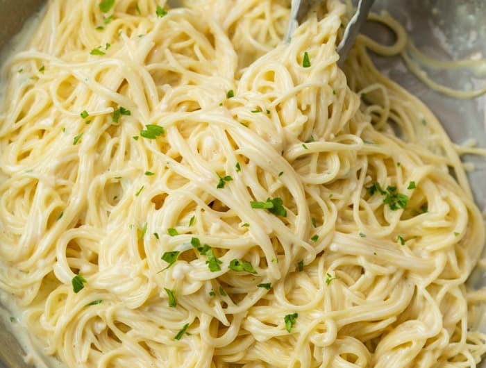 Garlic Parmesan Pasta in a skillet topped with parsley.