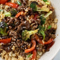 Ground beef and broccoli in a brown sauce over a bed of rice.