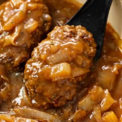 Hamburger Steak in brown gravy with onions.