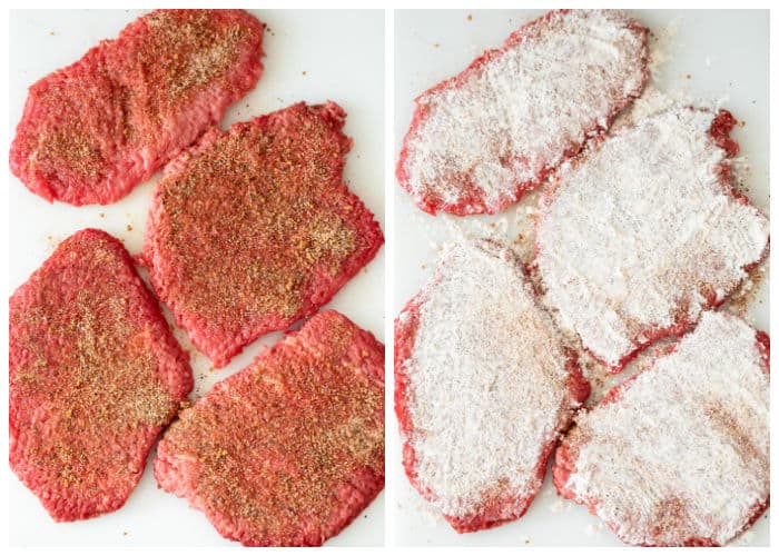 Cube steak with seasoning and flour on top before being cooked.