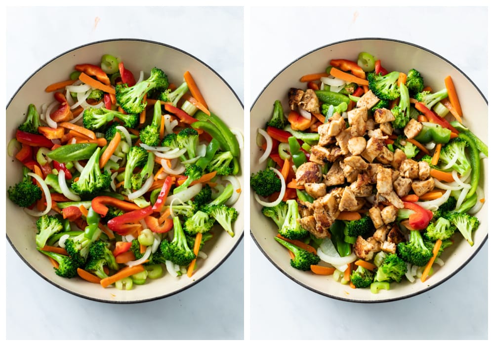 A skillet with sautéed vegetables with cooked chicken being added on top.