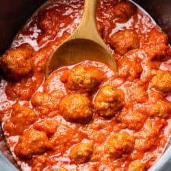 A Slow Cooker filled with Meatballs and Marinara Sauce