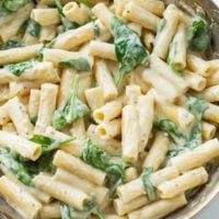 Creamy Spinach Pasta in a silver skillet.