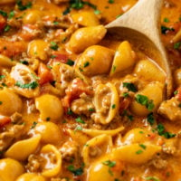 A pot full of Taco Pasta with pasta shells in a creamy taco sauce.